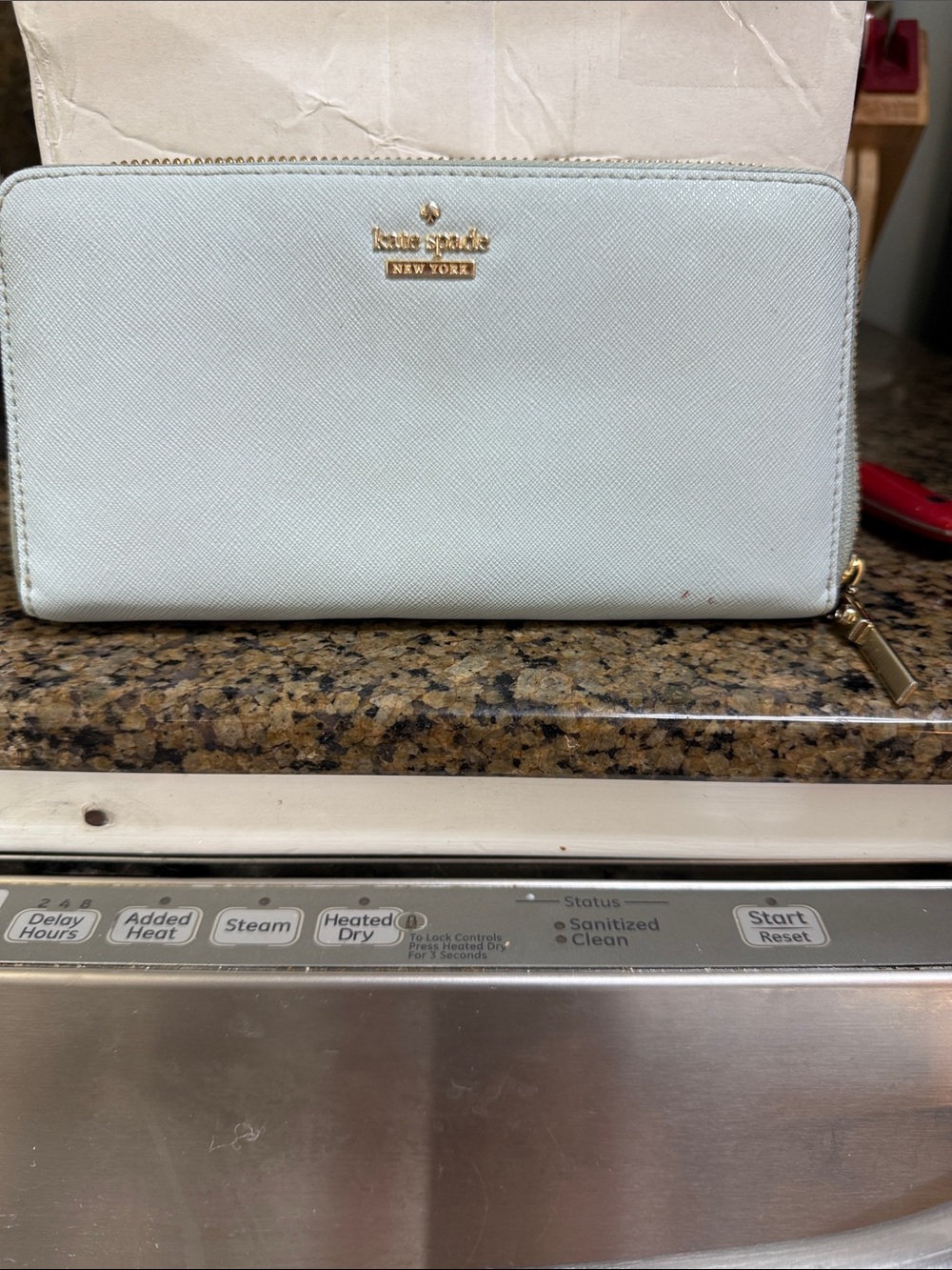 kate spade pale blue zip-around wallet with gold logo